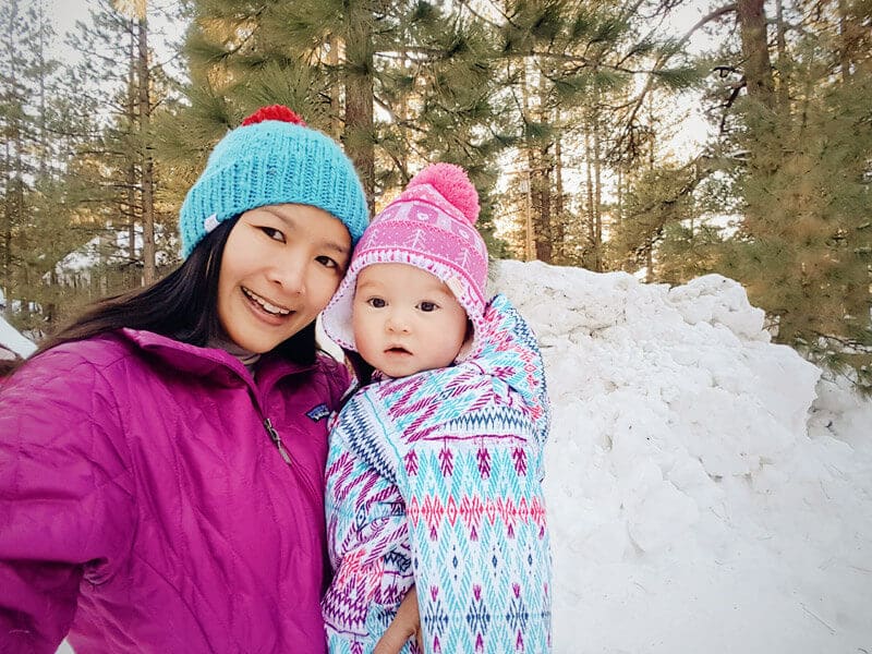 Wearing an insulated snowsuit and fleece-lined beanie