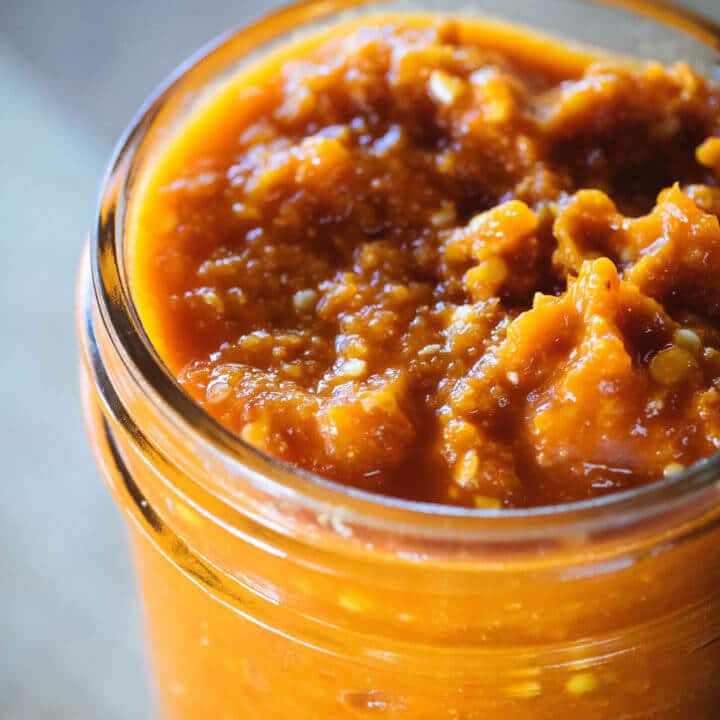 Chunky fermented hot sauce in a jar