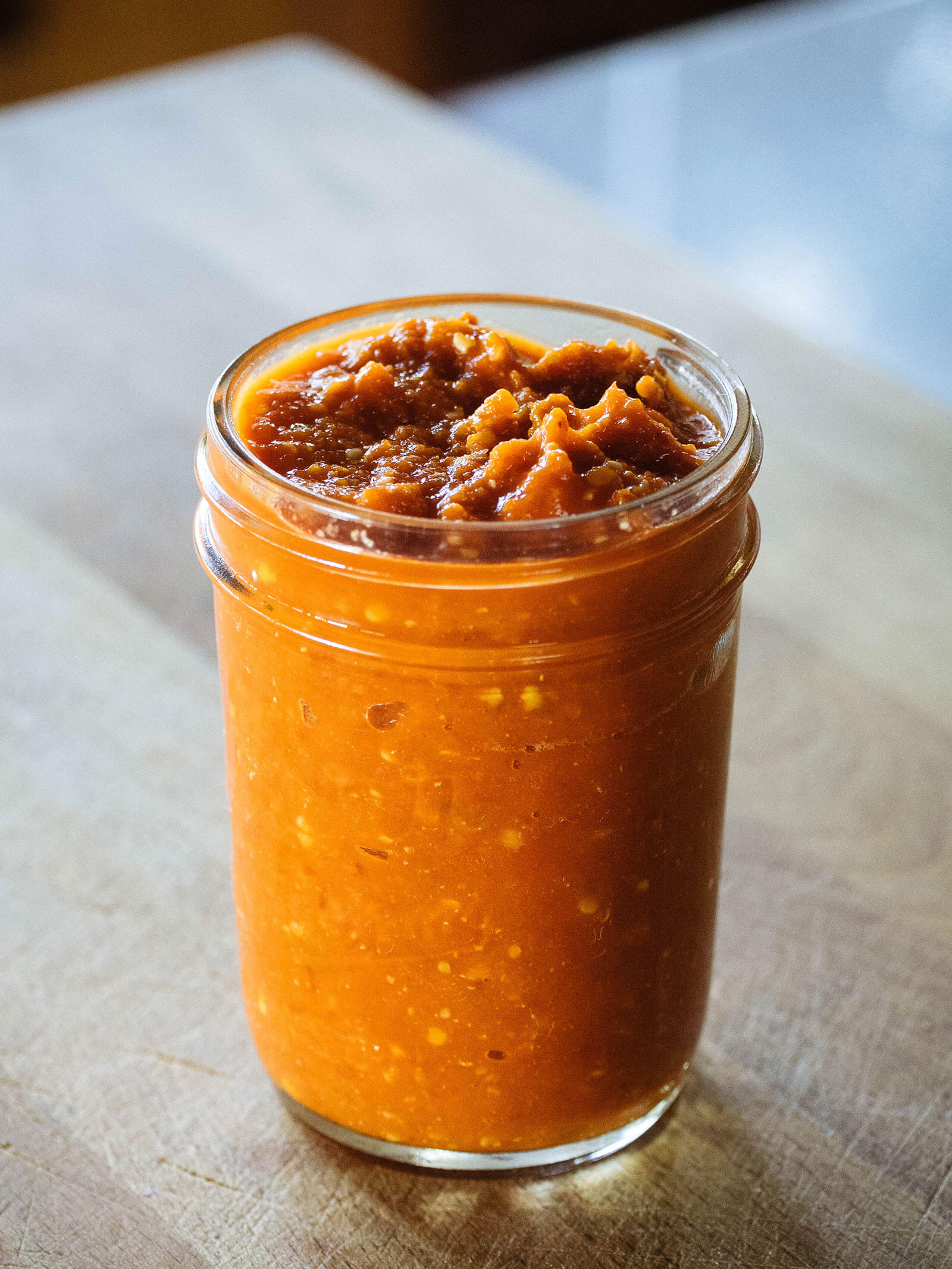 Mason jar filled with homemade fermented hot sauce