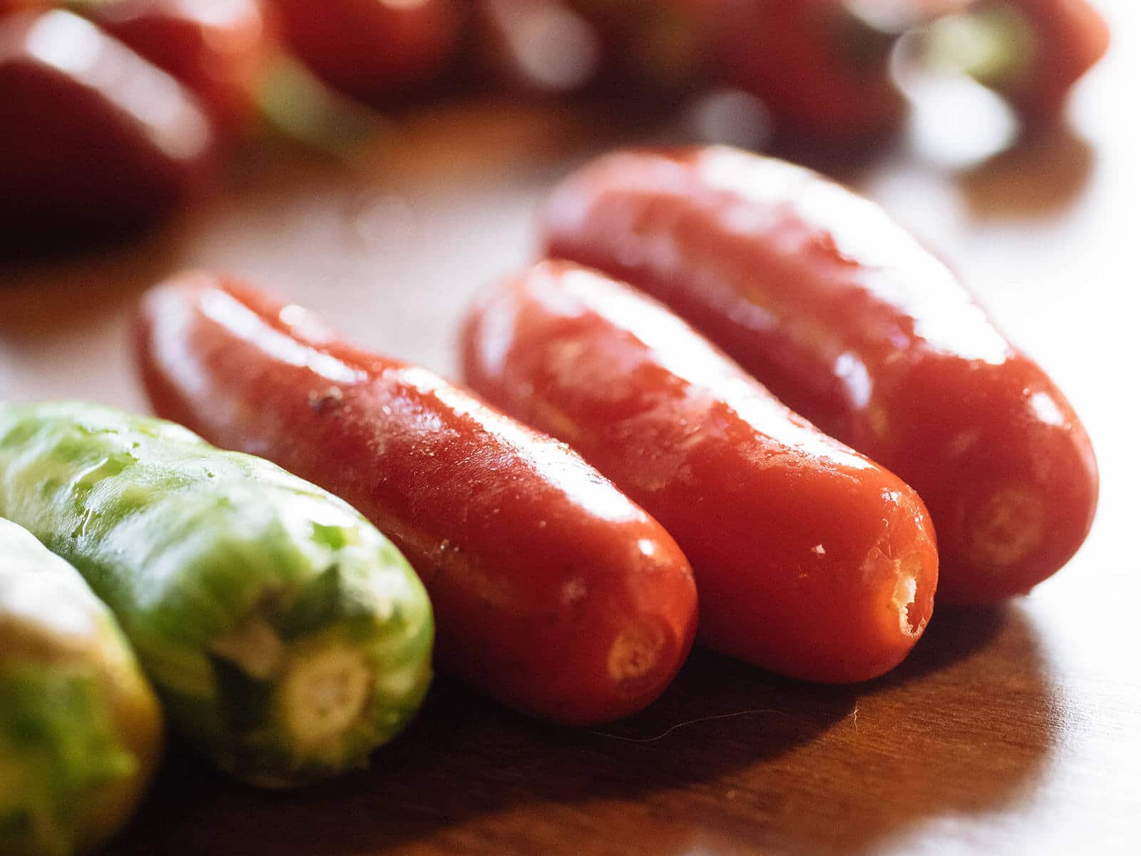 Serrano peppers with their stems and caps detached