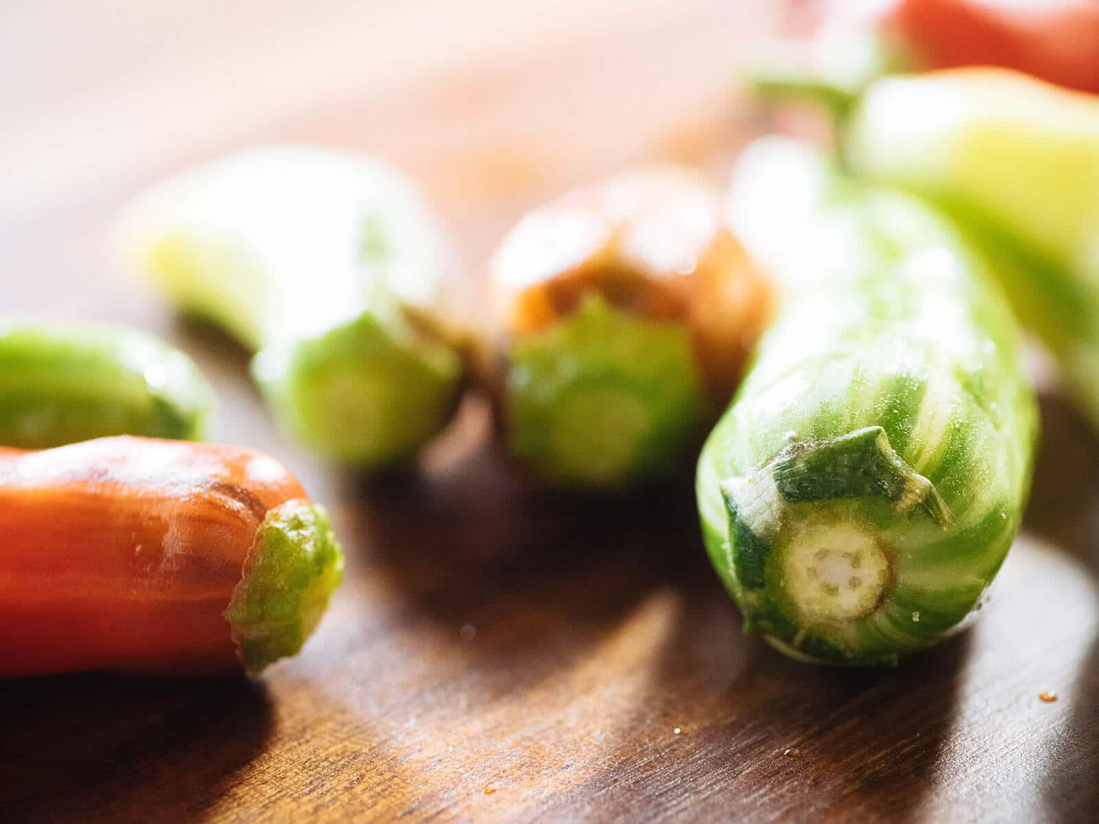 Chile peppers destemmed with their green caps intact