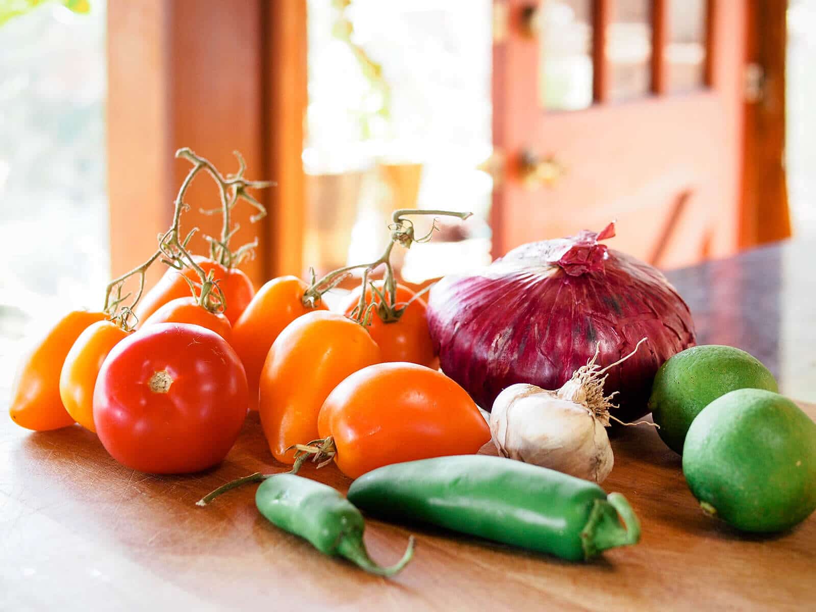 Salsa ingredients sitting on a cutting board