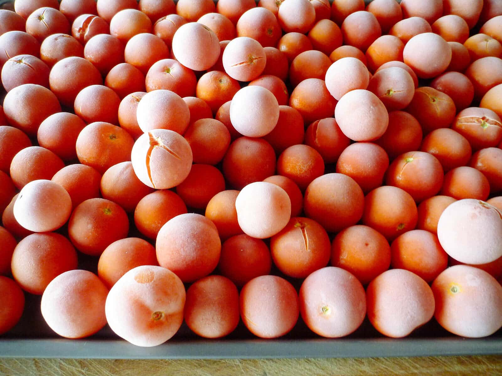 Close-up of frozen whole cherry tomatoes